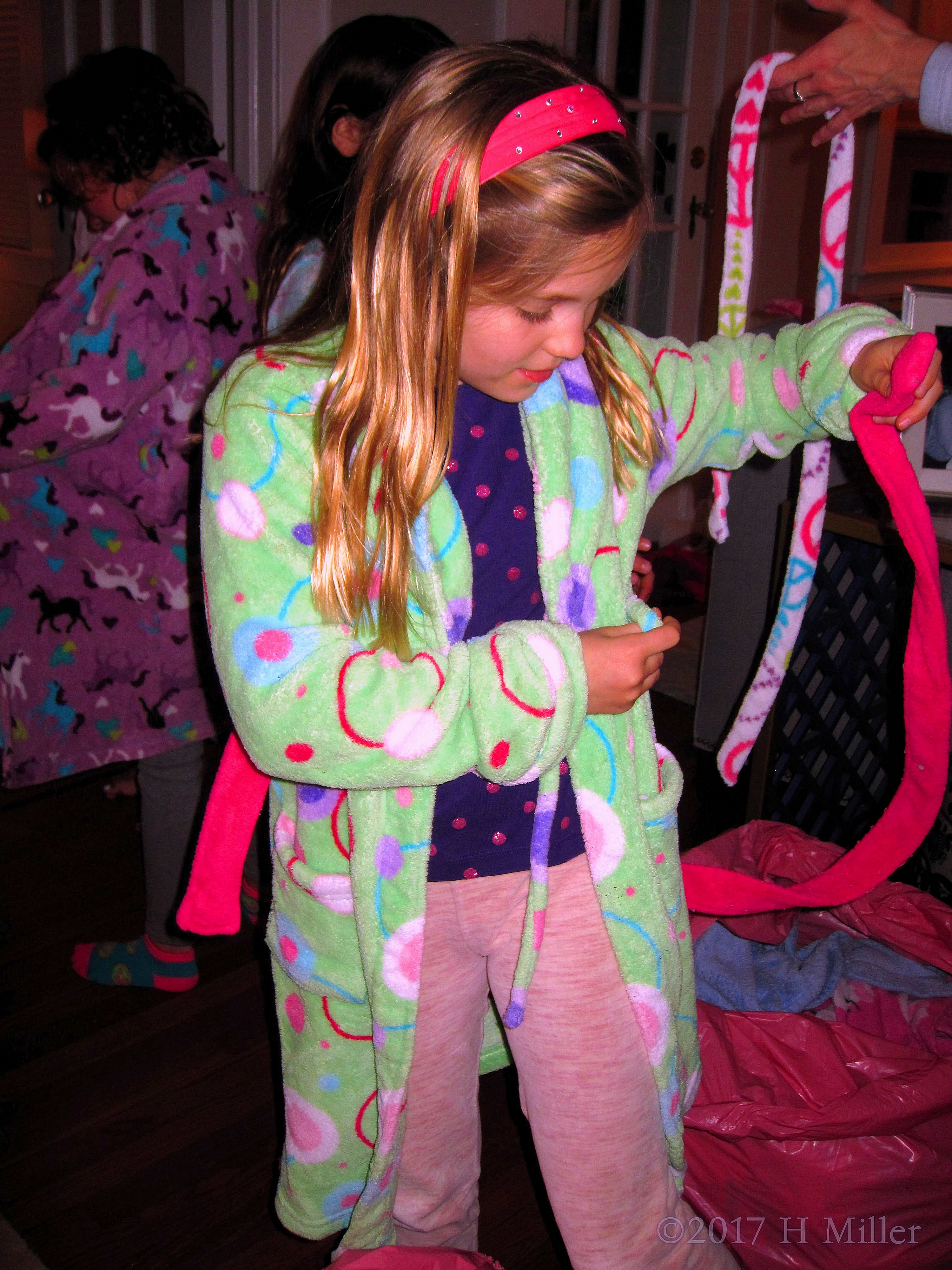 Kids Spa Guest Is Tying The Sash Of Her Spa Robe Kids Spa Guest Is Tying The Sash Of Her Spa Robe