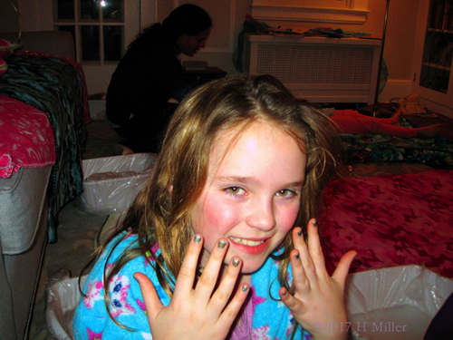 Showing Off Her Sparkly Kids Manicure