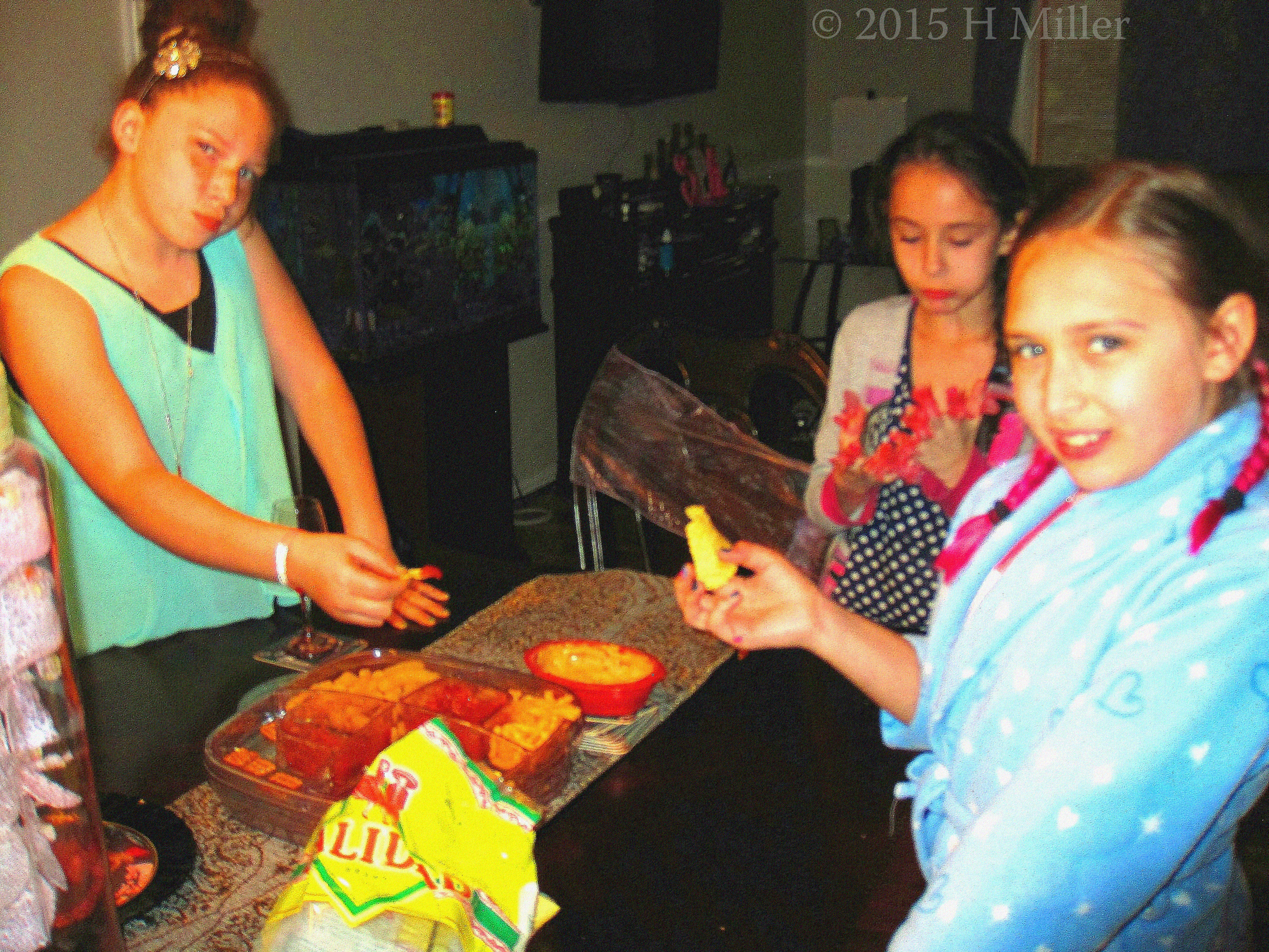 Guests Snacking On Goodies At The Spa Party. Guests Snacking On Goodies At The Spa Party.