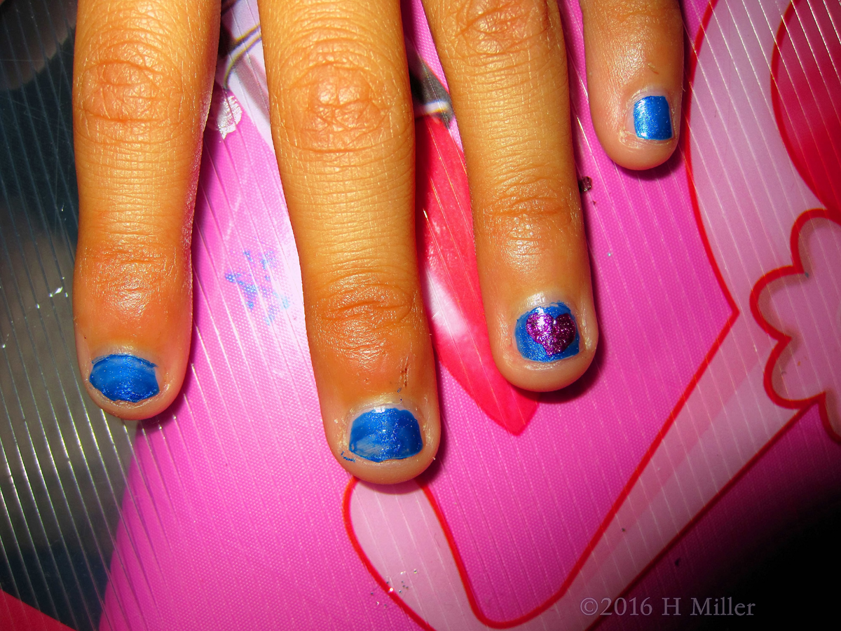 Kids Nail Art On A Blue Mani With A Pink Heart 