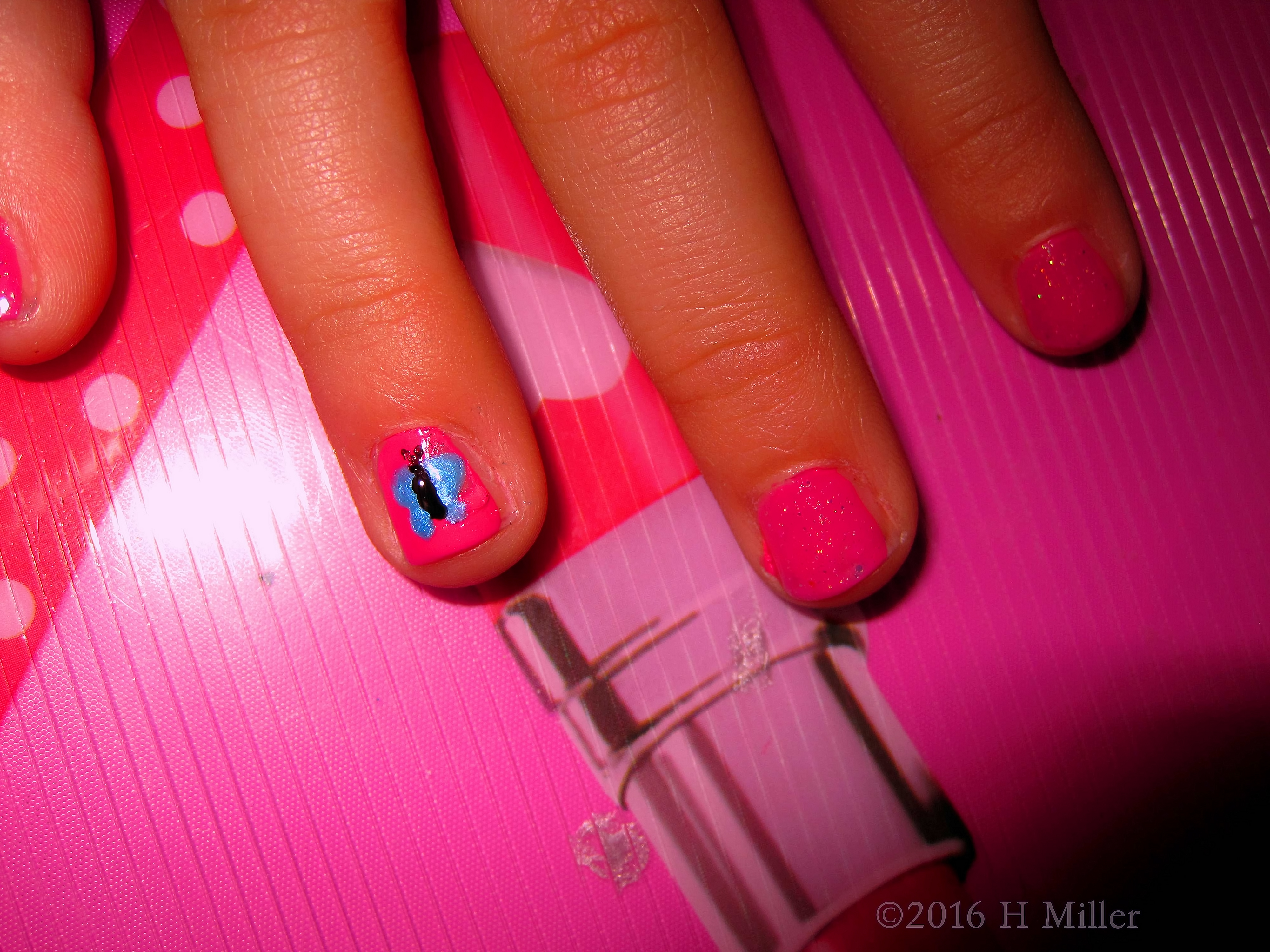 A Cute Nail Design Of A Pretty Blue Butterfly On Pink Background A Cute Nail Design Of A Pretty Blue Butterfly On Pink Background