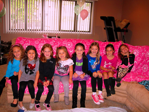 Birthday Girl Poses With Her Friends For A Pictur