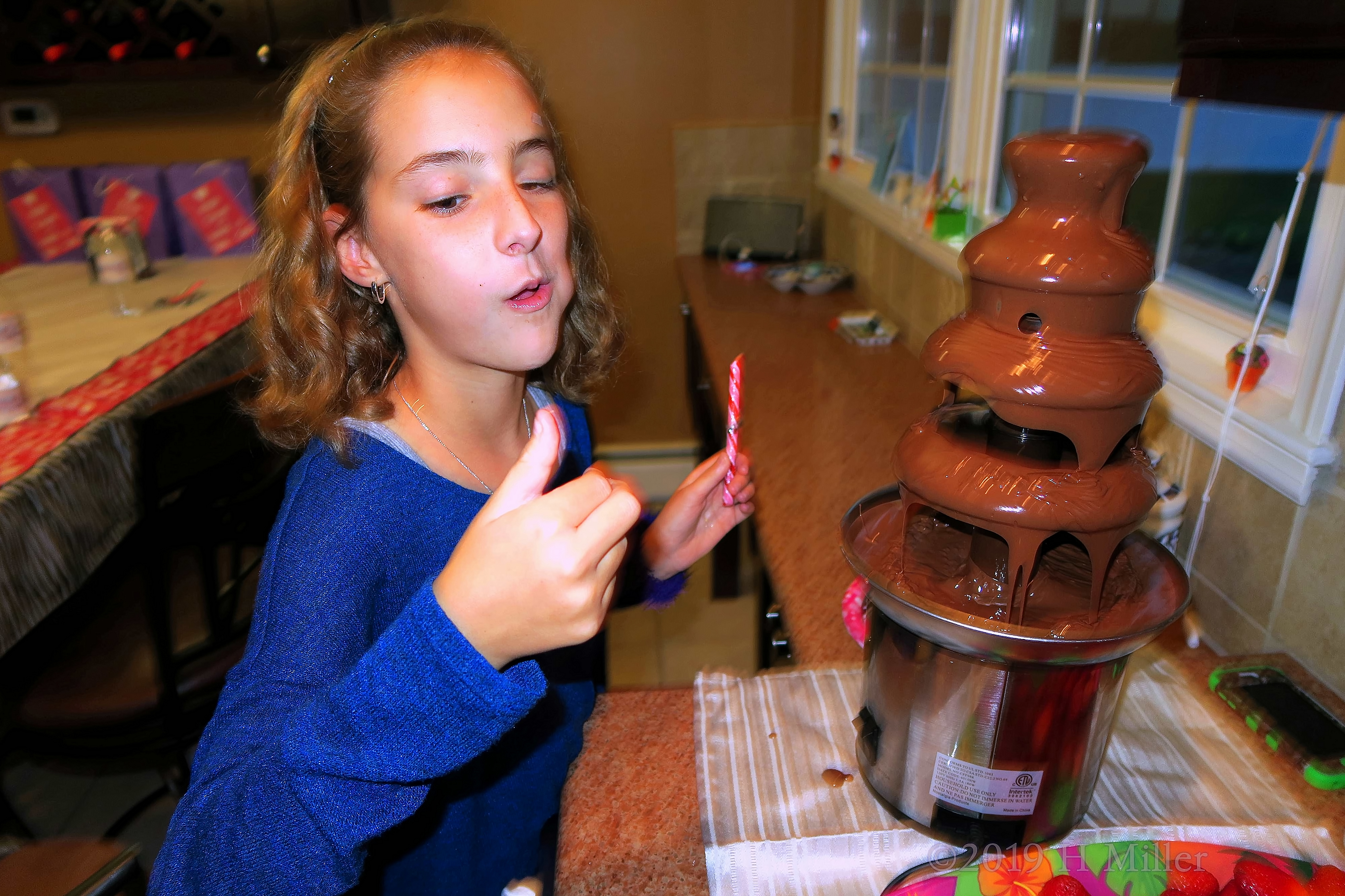 Party Guest Having A Blast With Chocolate 