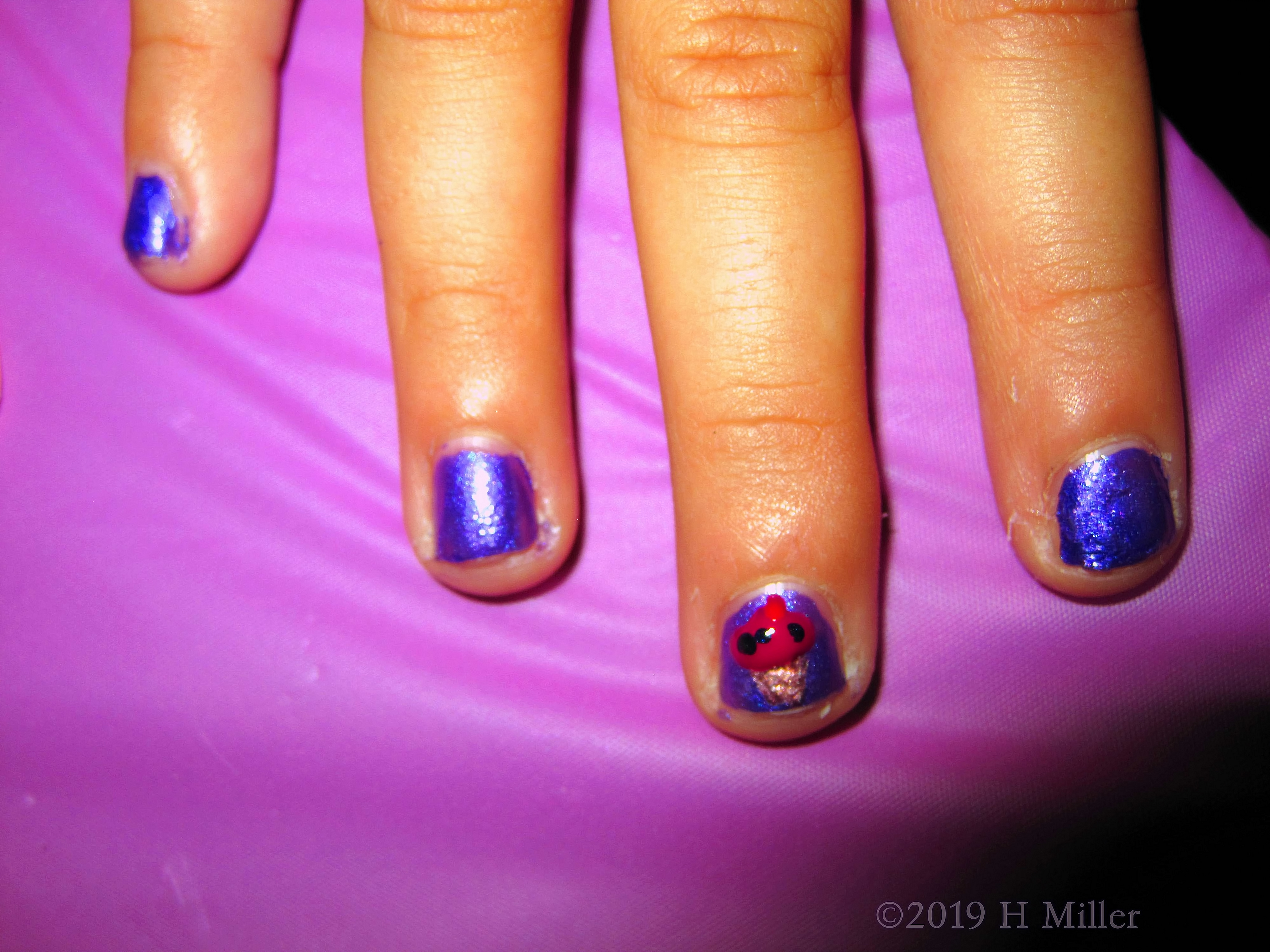 Purple Base Coat With Accent Cupcake Nail Art. 