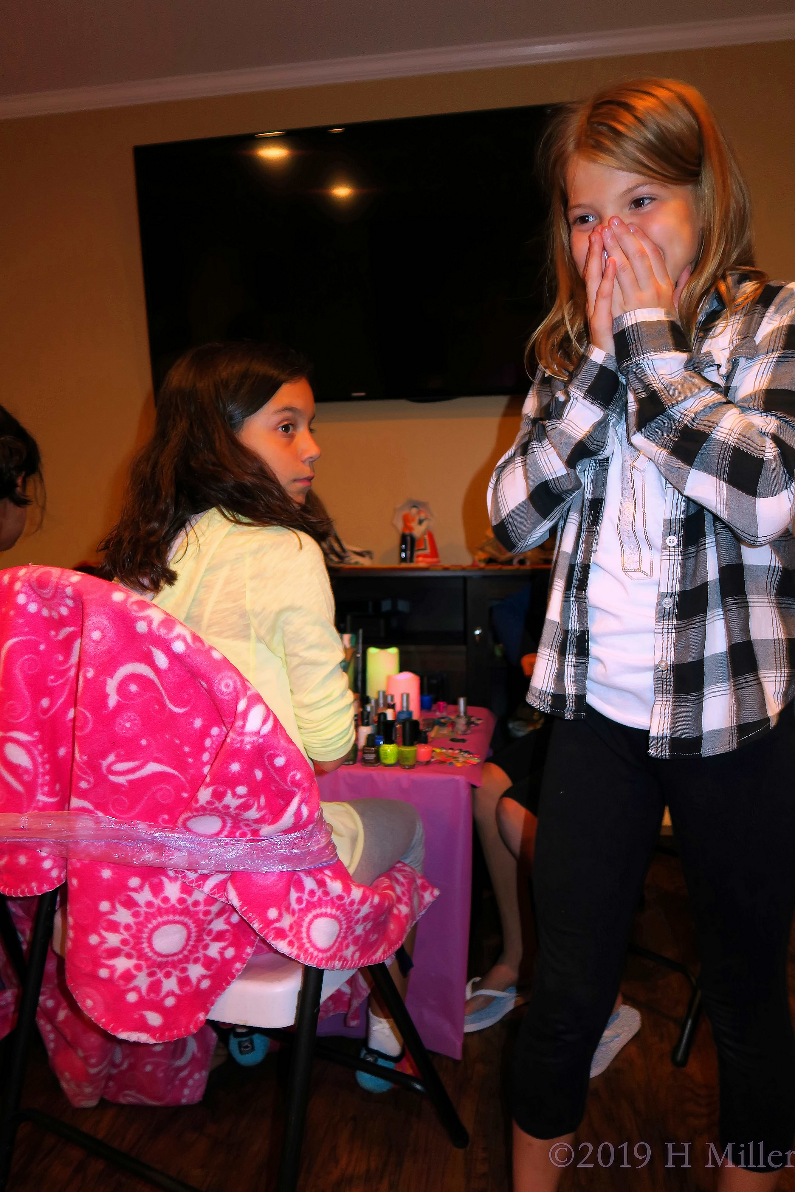 Party Guests Having Fun At The Kids Nail Art Station 