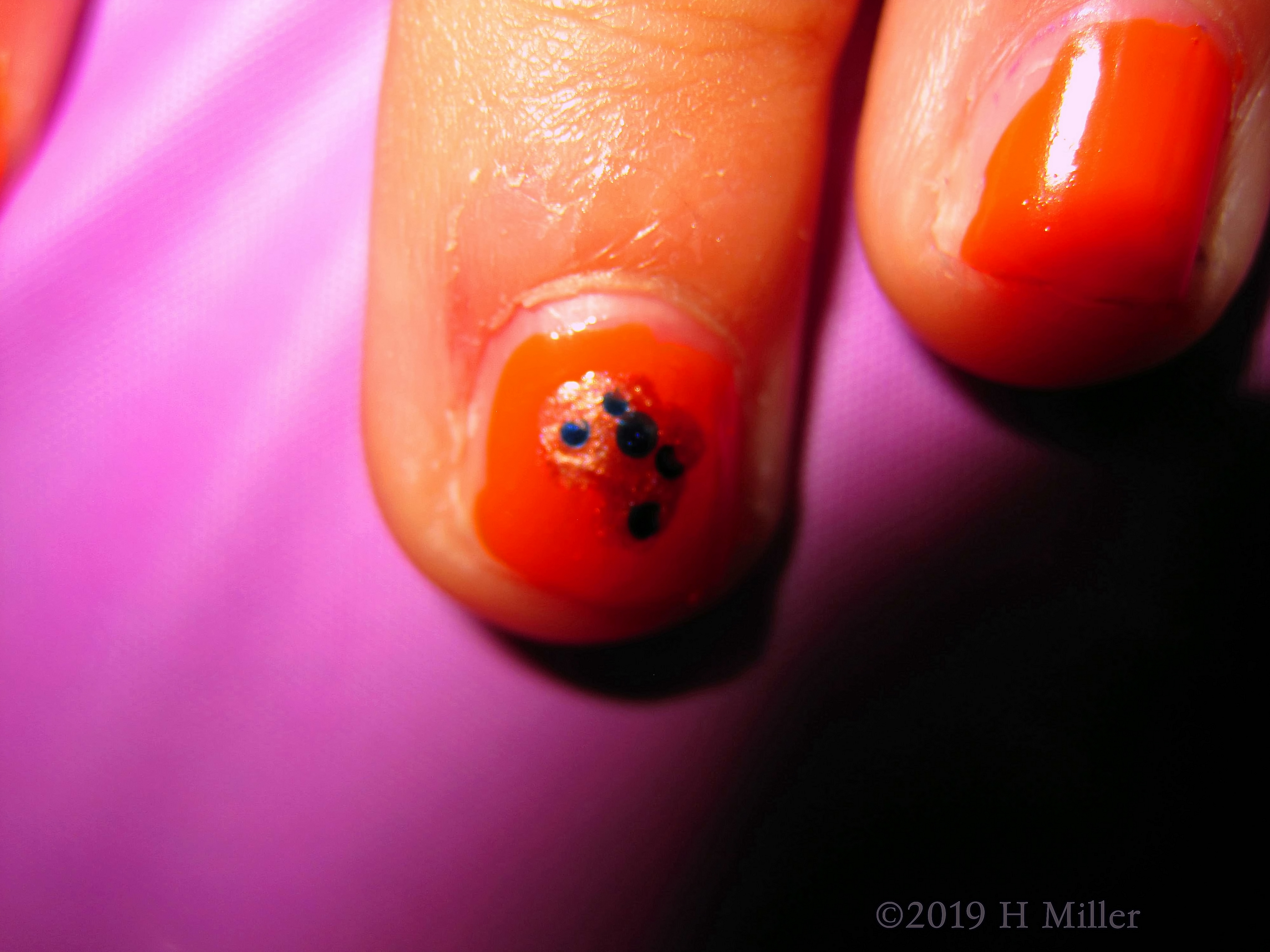 Close Up Of Accent Nail Design With Blue Dots Close Up Of Accent Nail Design With Blue Dots