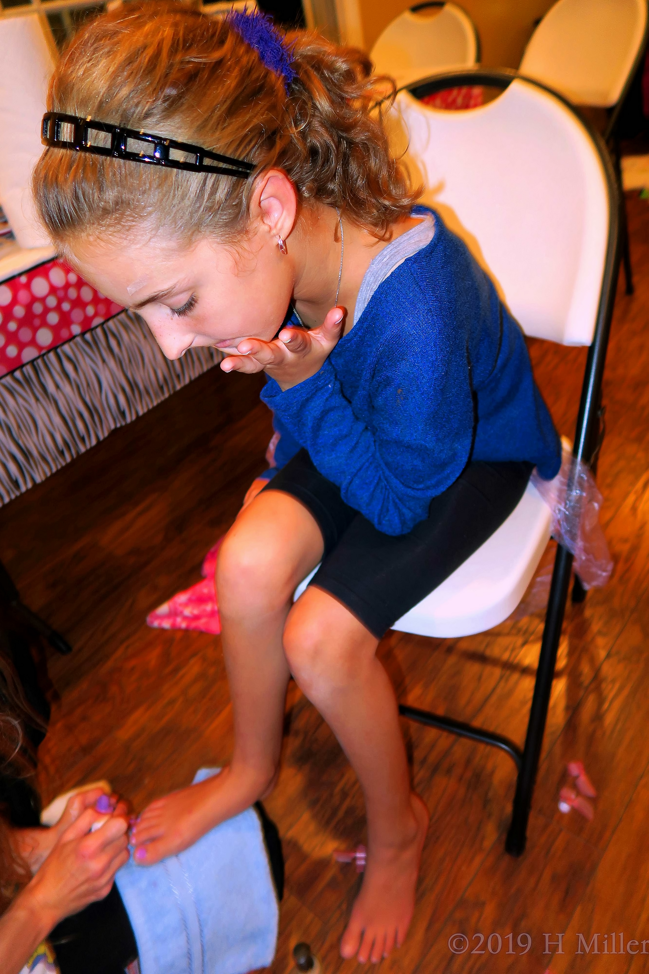 Party Guest Observing While Her Girls Manicure Gets Done 