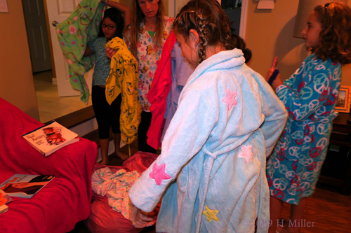 Party Guests Picking Out Their Spa Robes