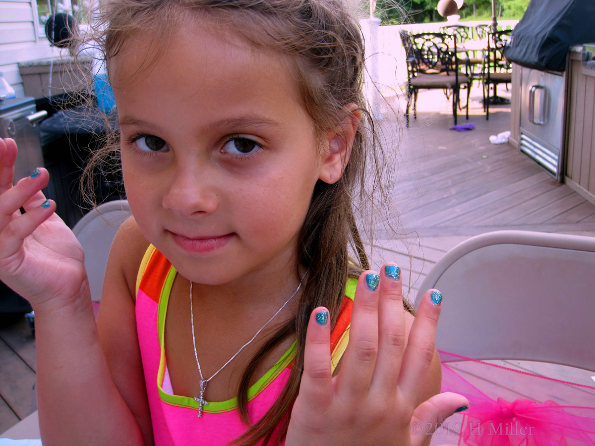 Party Guest Showing Off Her Nail Art Design Creation 