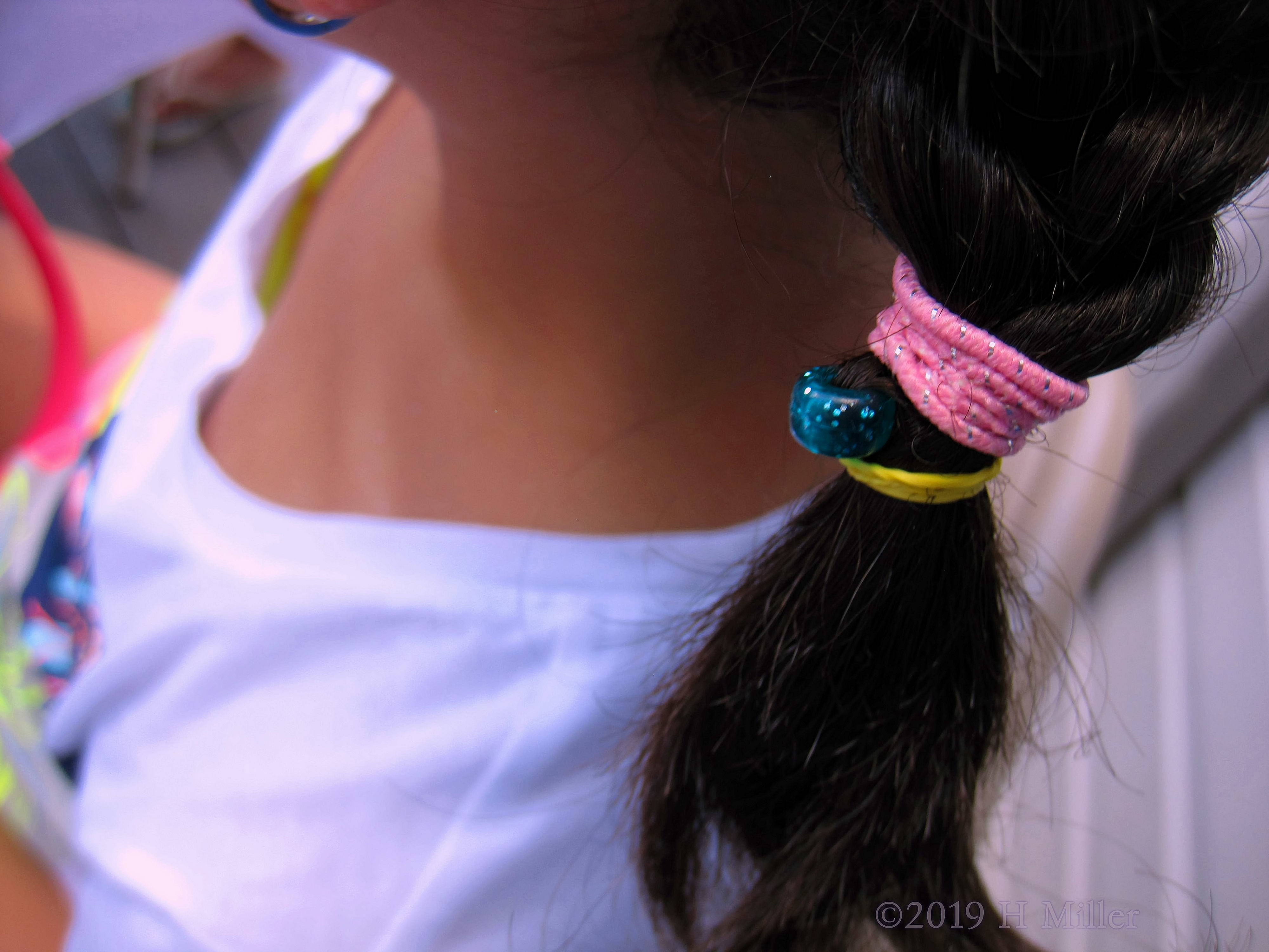 Colorful Hair Tie Holding French Braid Girls Hairstyle Securely In Place 
