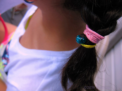 Colorful Hair Tie Holding French Braid Girls Hairstyle Securely In Place Colorful Hair Tie Holding French Braid Girls Hairstyle Securely In Place