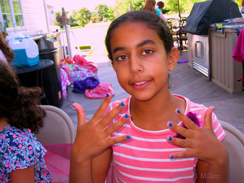 Party Guest Showing Off Her Nail Design 