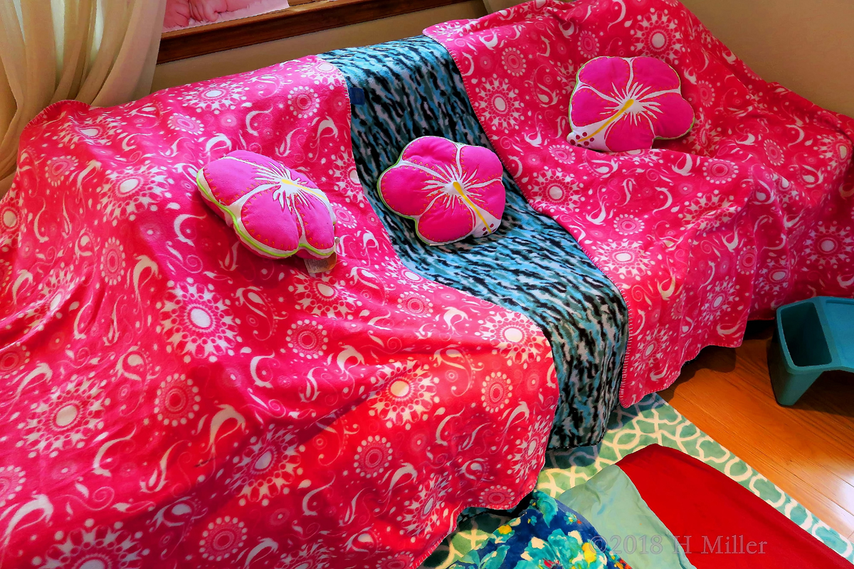 Couch Covered With Bright Spa Throws And Comfy Pillows! 