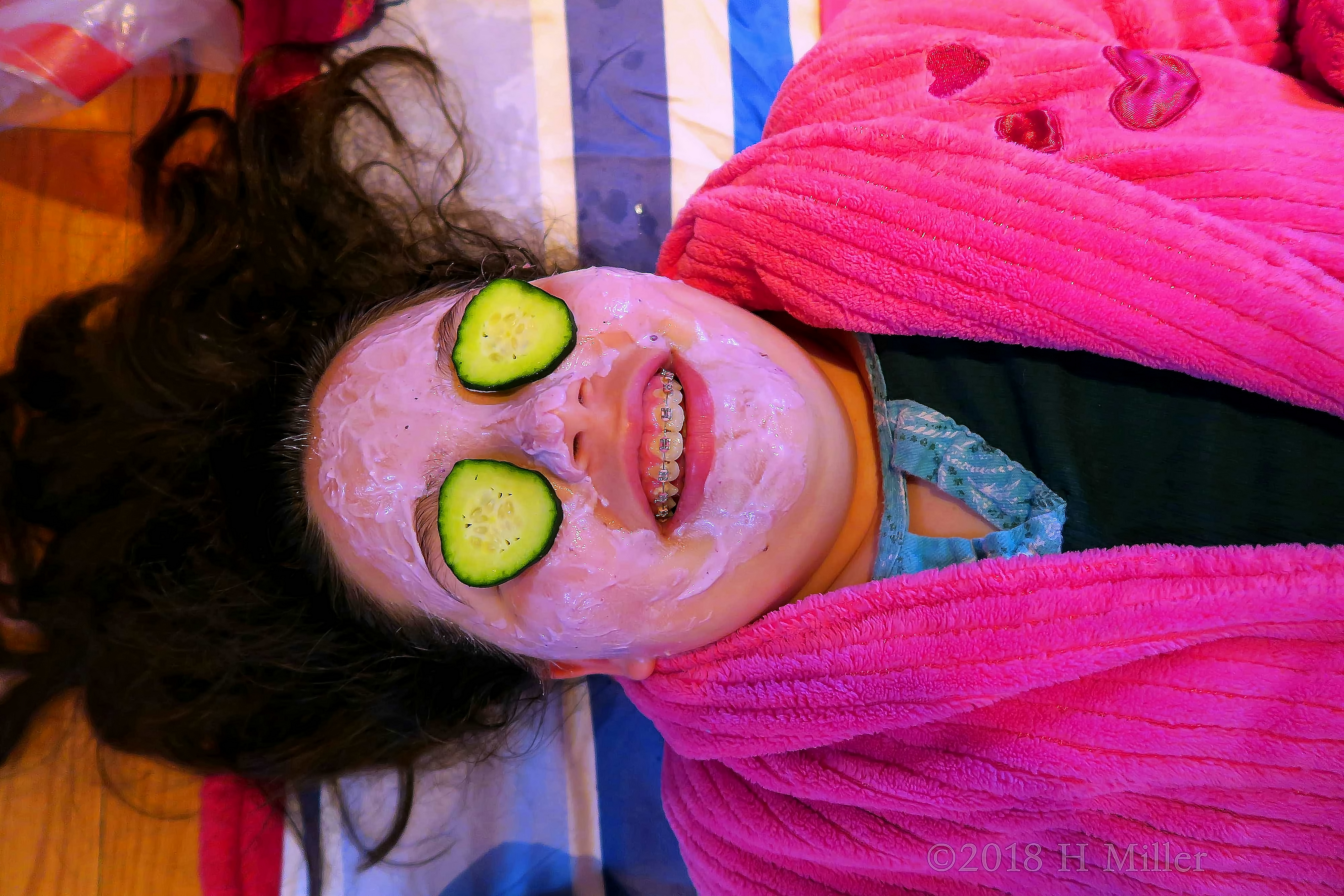 Smiling Big As She Poses For A Girls Facial Photo. 