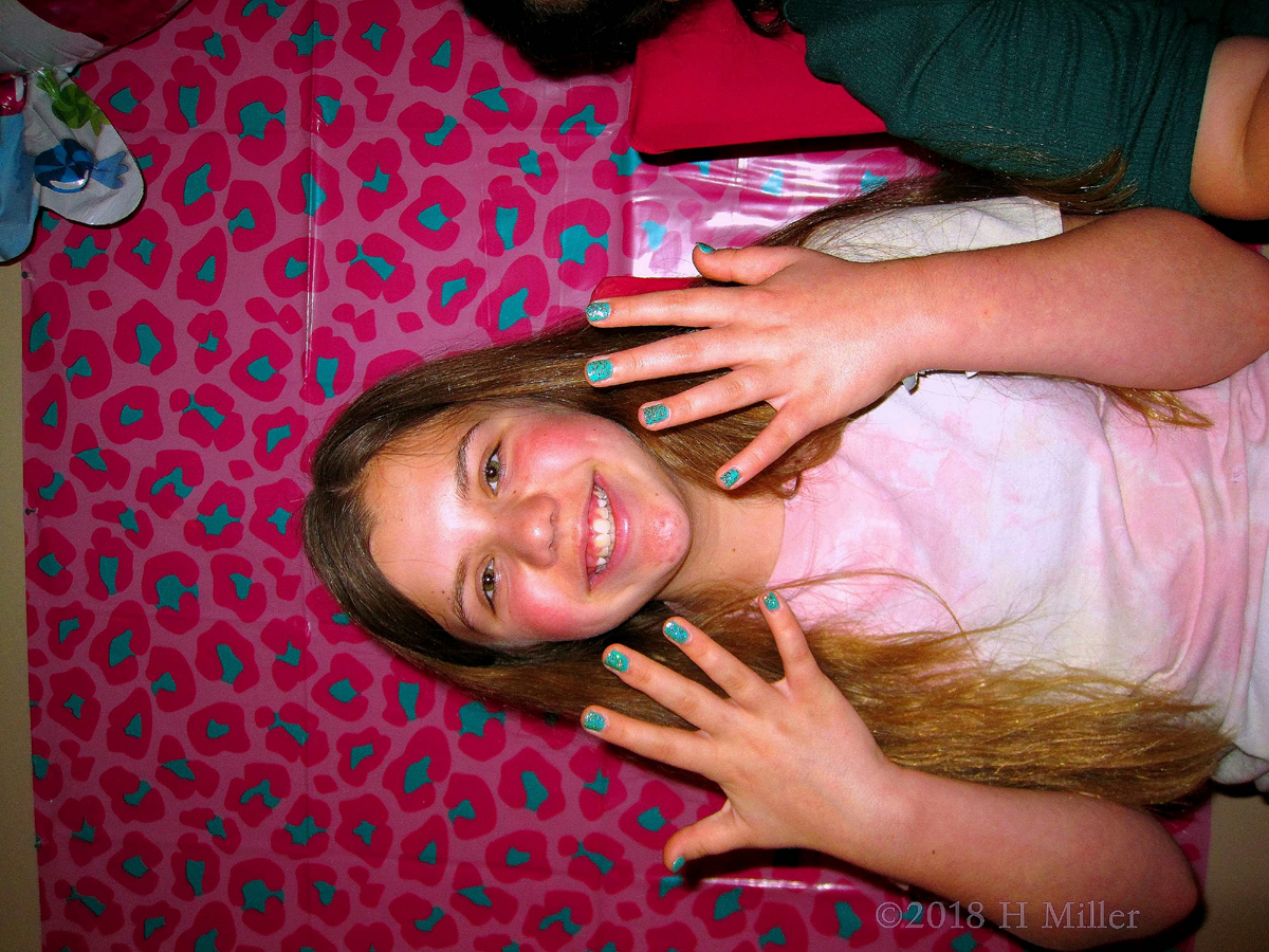 She's Happy With Her Glittery Green Mini Mani.