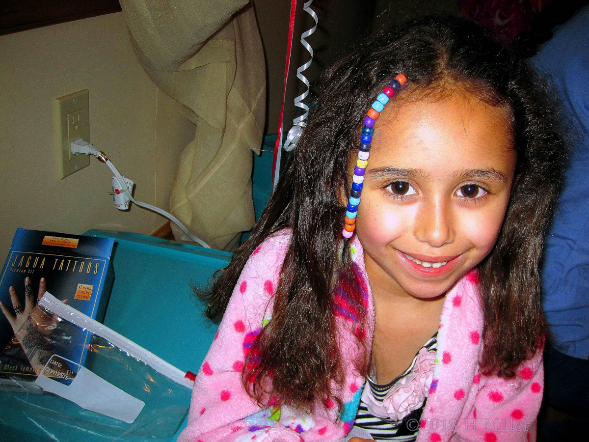 She Opts For A Fun Girls Hairstyle Look With Those Colorful Beads!