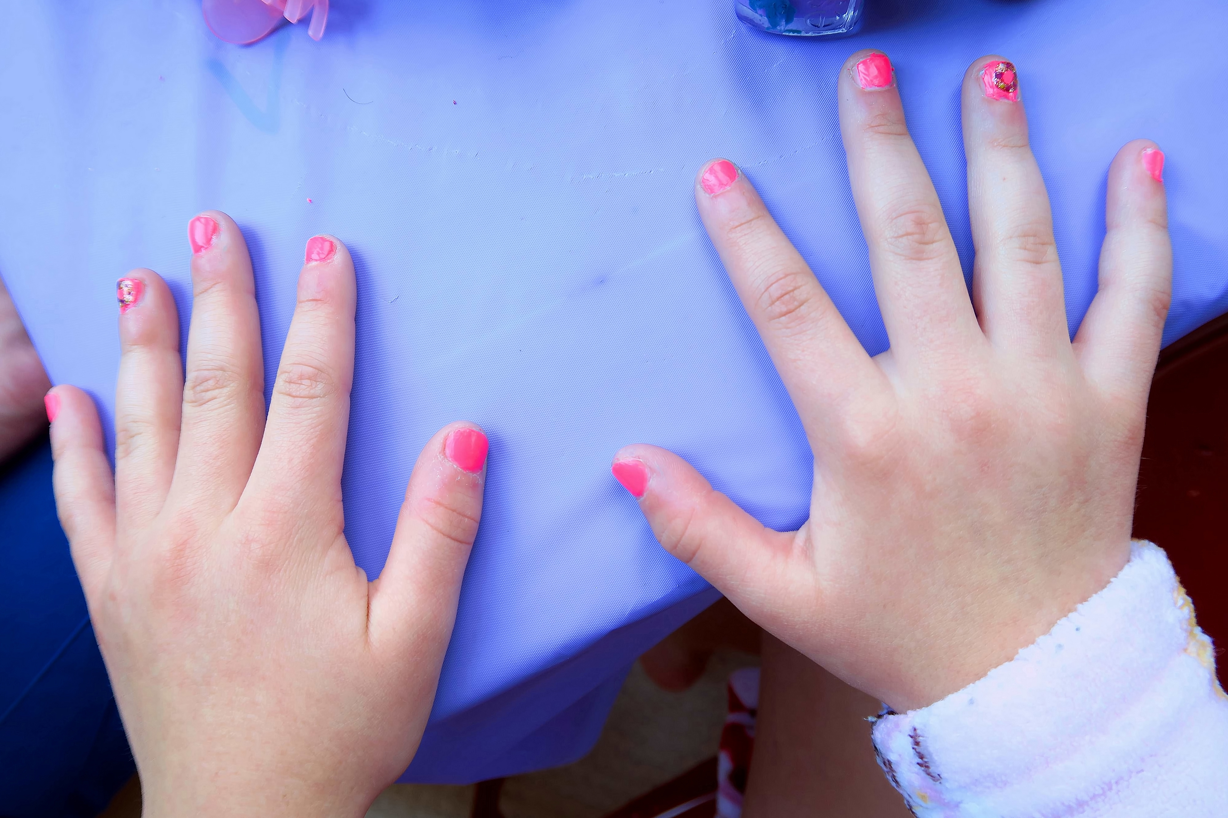Donuts On Her Nails At Riley's Party. Donuts On Her Nails At Riley's Party.