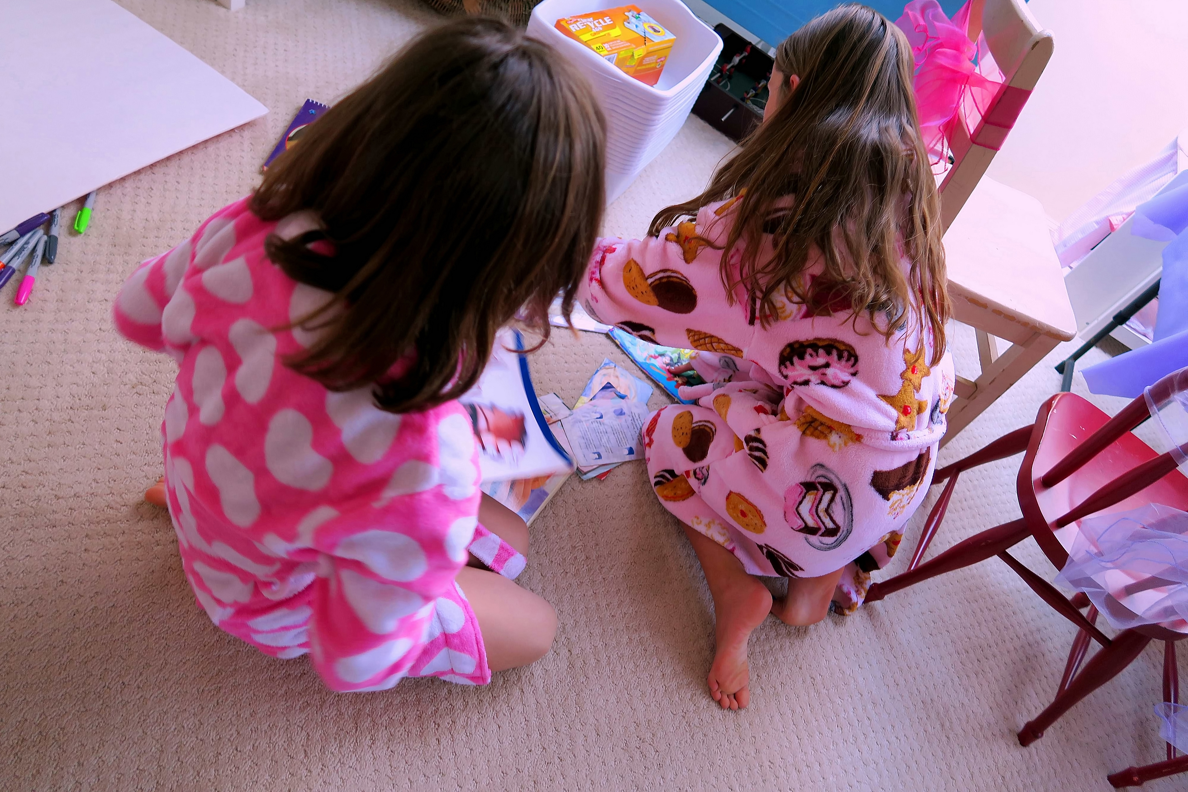 The Girls Perusing The Nail Art Design Books. The Girls Perusing The Nail Art Design Books.
