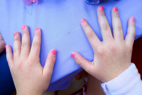 Donuts On Her Nails At Riley's Party. Donuts On Her Nails At Riley's Party.
