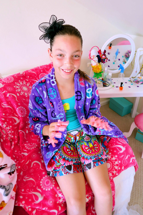 Soaking In The Footbath With Nail Protectors On Her Fingers, At Riley's Home Spa Party. Soaking In The Footbath With Nail Protectors On Her Fingers, At Riley's Home Spa Party.