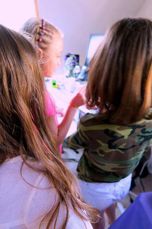 The Birthday Girl Shakes The Lip Balm She's Making. The Birthday Girl Shakes The Lip Balm She's Making.