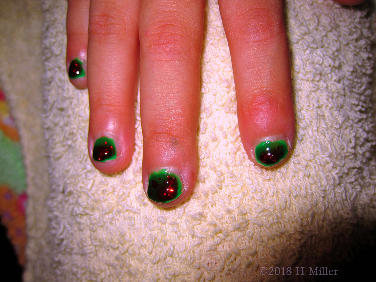 Green Base Coat With Red Sparkly Overlay Kids Manicure. 