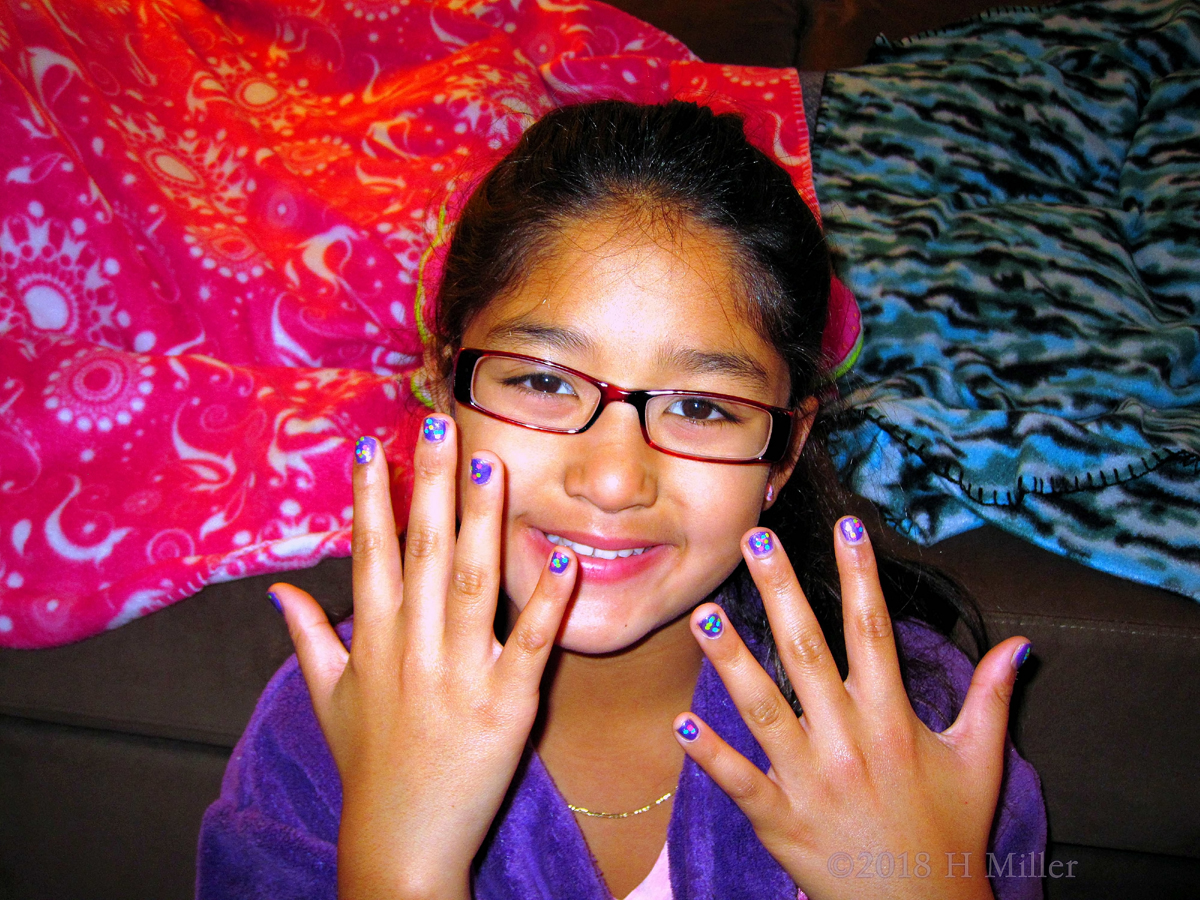 Showing Off Her Kids Manicure Greatness 
