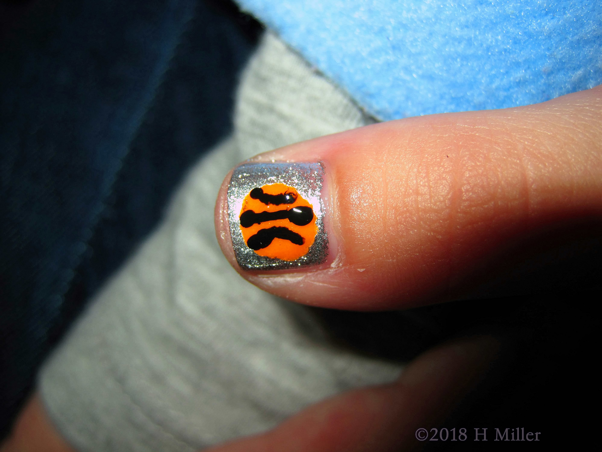 Silver Base Girls Manicure With Orange And Black Basketball Nail Art 
