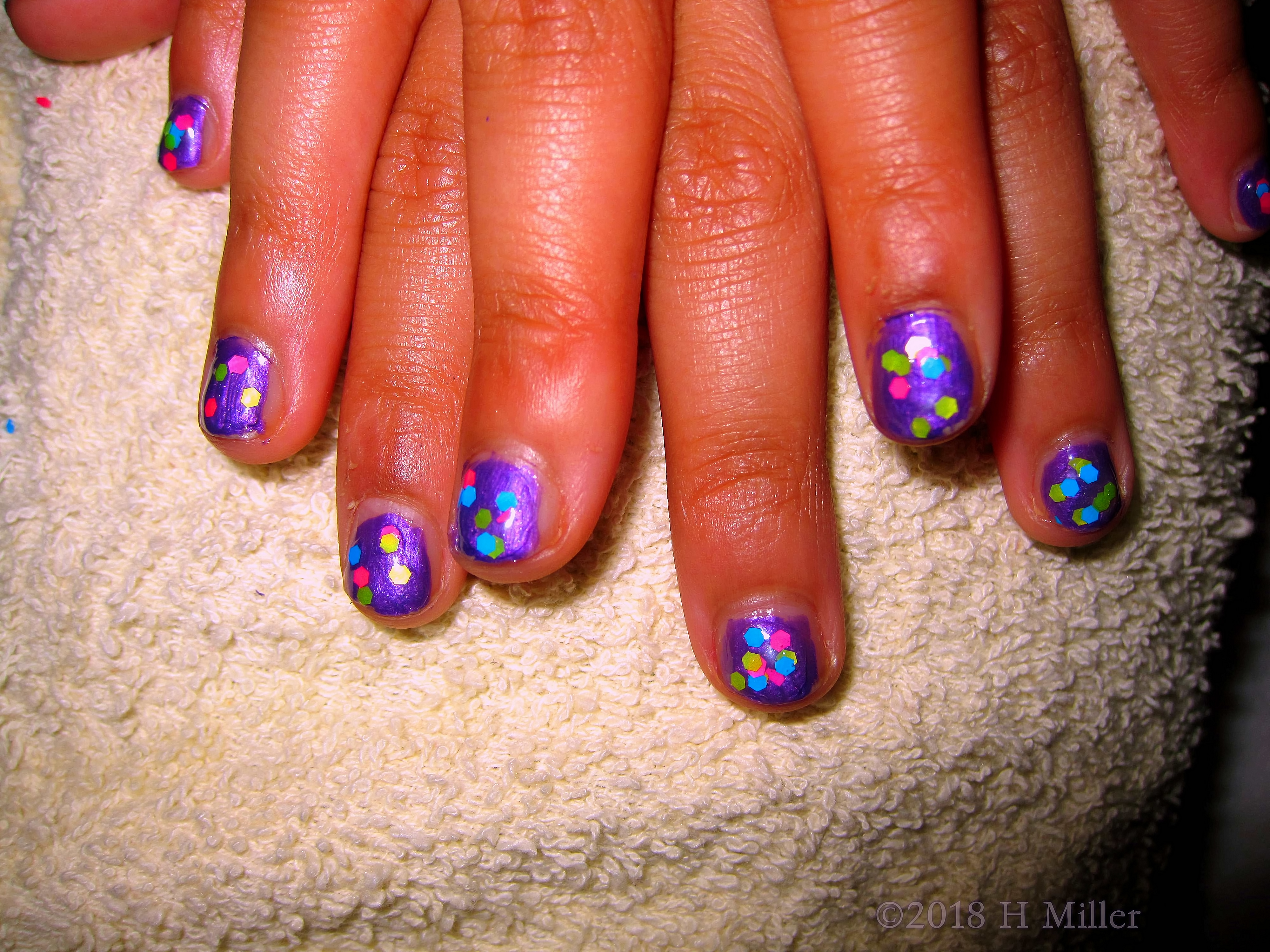 Purple Base Color With Multicolored Polkadot Overlay Girls Manicure. Purple Base Color With Multicolored Polkadot Overlay Girls Manicure.