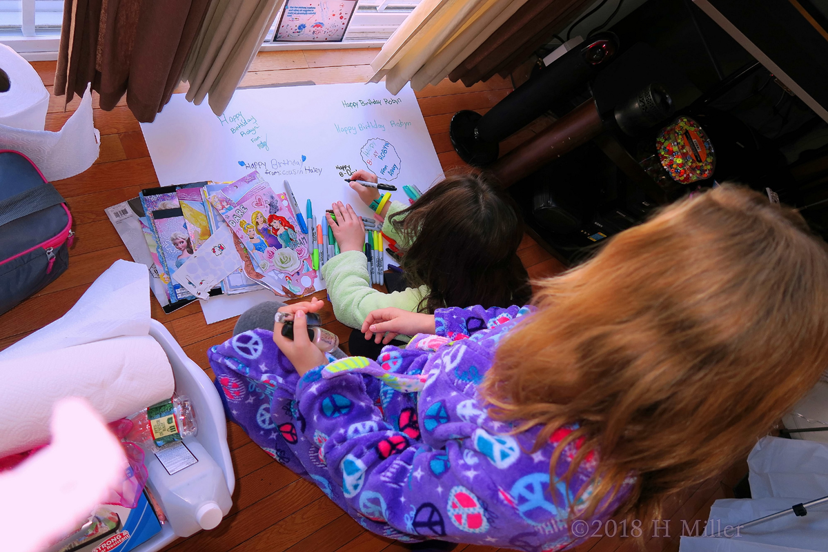 Party Guests Designing Robyn's Spa Birthday Card With Stickers, Markers, And Lots Of Love! 