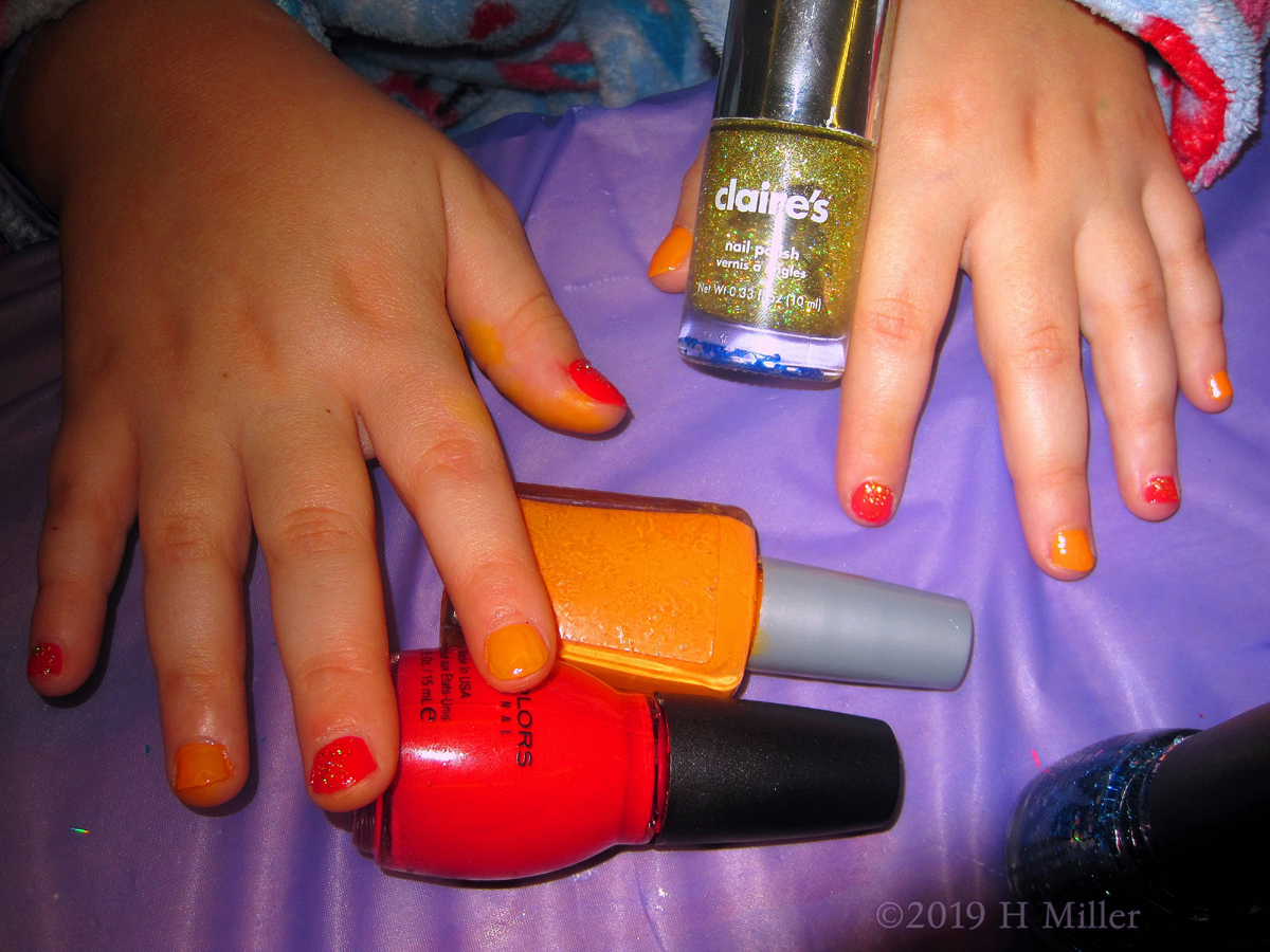 Red And Orange Masterpiece Manicure For Kids With Gold Glitter Overlay 