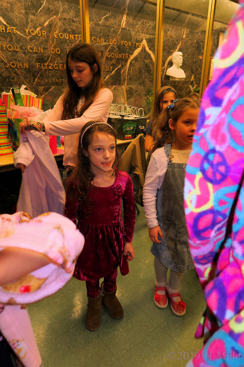 Party Guests Choosing Their Comfy Spa Robes