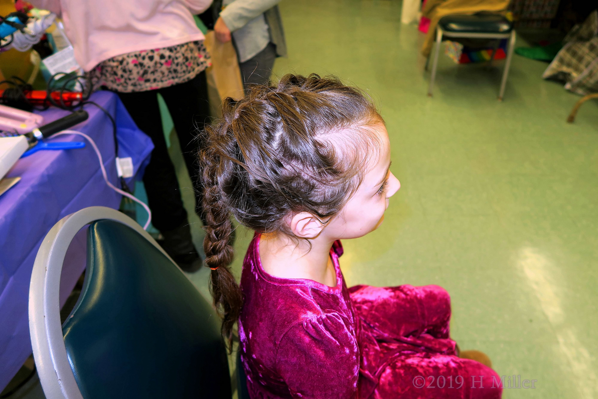 Party Guest Showing Off Her Kids Hairstyle For The Camera 