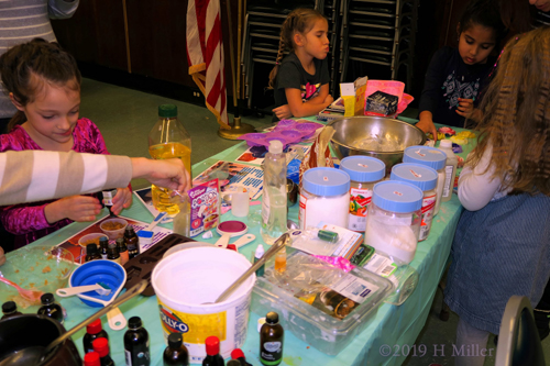 Party Guests Having Fun At The Crafts For Kids Station