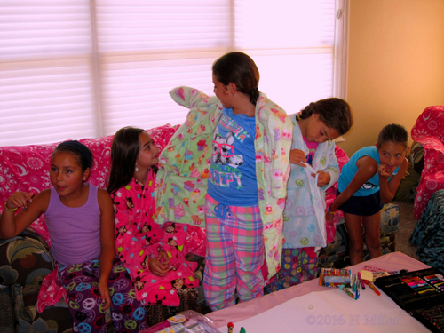 Putting On Their Spa Robe Putting On Their Spa Robe