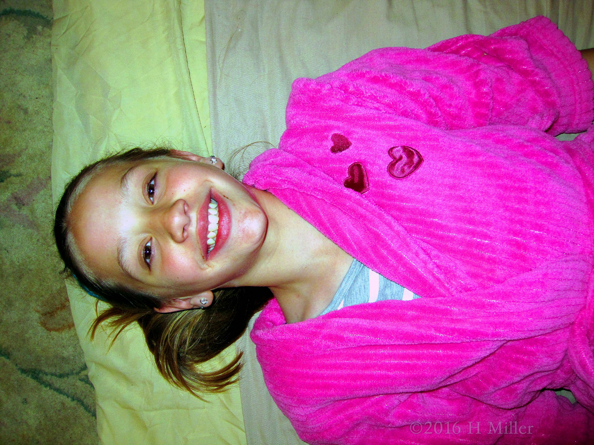 Smiling Girl Just Before The Facial For Kids Activity Begins. 