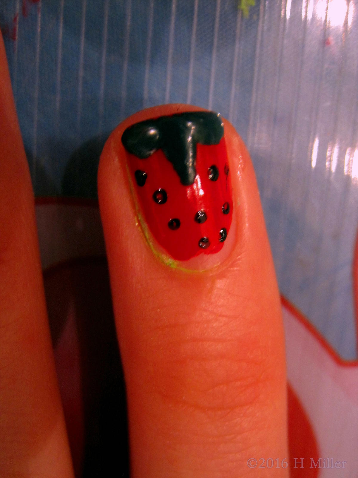 Zoomed In Look Of The Perfectly Done Strawberry Nail Art.