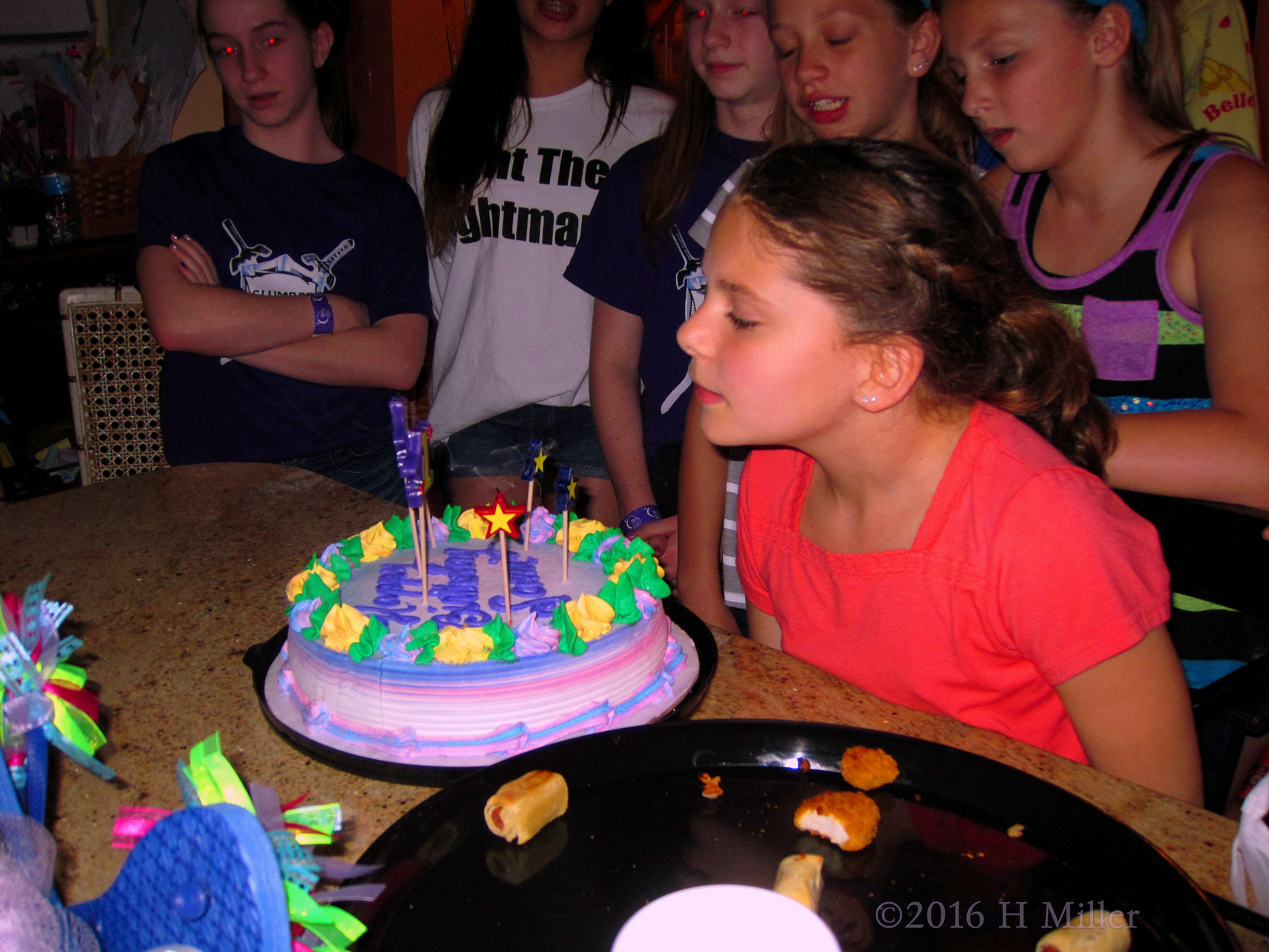 After Blowing Out The Birthday Candles, It's Time To Cut The Cake. After Blowing Out The Birthday Candles, It's Time To Cut The Cake.