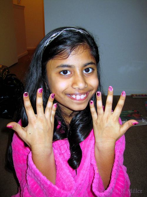 The Birthday Girl Smiling With Her New Mini Mani. The Birthday Girl Smiling With Her New Mini Mani.
