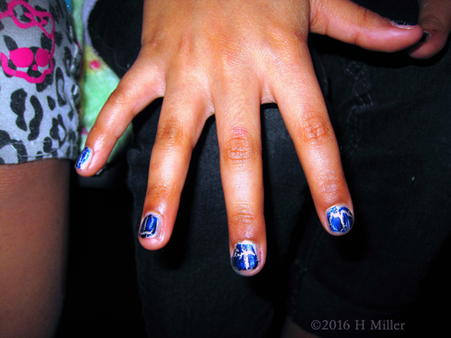 Blue Opi Shatter On Silver Metallic Background. Blue Opi Shatter On Silver Metallic Background.
