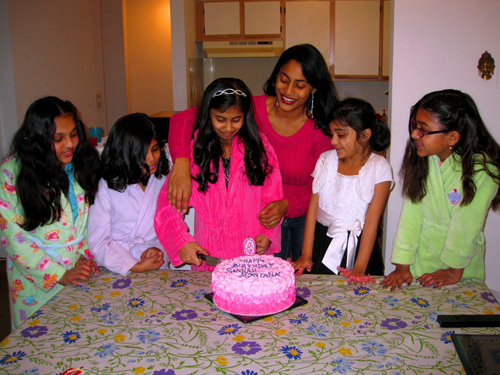 Helping Her Cut The First Piece of Cake. Helping Her Cut The First Piece of Cake.