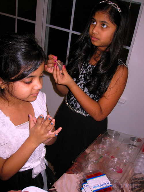 Kids Spa Party Crafts. Stirring The Lip Balm Mixture. Kids Spa Party Crafts. Stirring The Lip Balm Mixture.