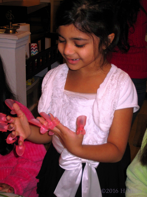 Wondering How She Will Eat With The Nail Protectors On! Wondering How She Will Eat With The Nail Protectors On!