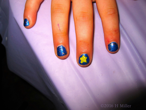 Buttercup And Blue Manicure With A Star Nail Art
