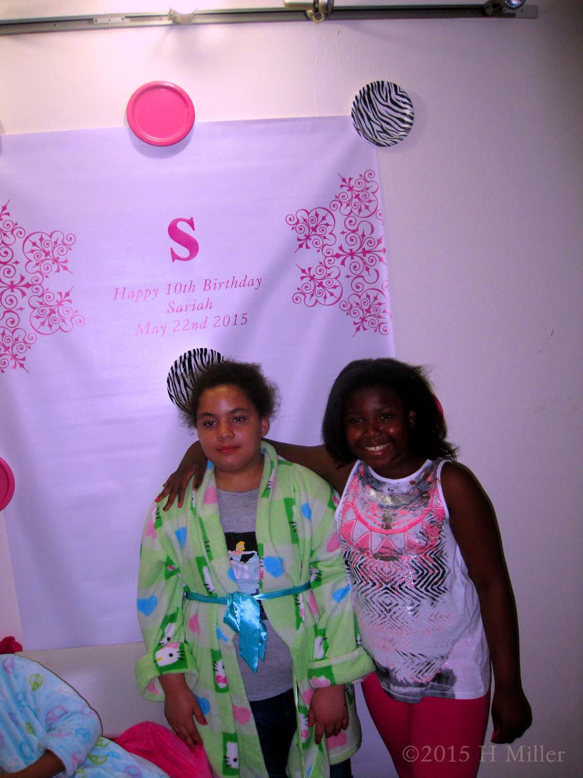 Sariah Poses In Front Of The Birthday Banner With Her Friend 