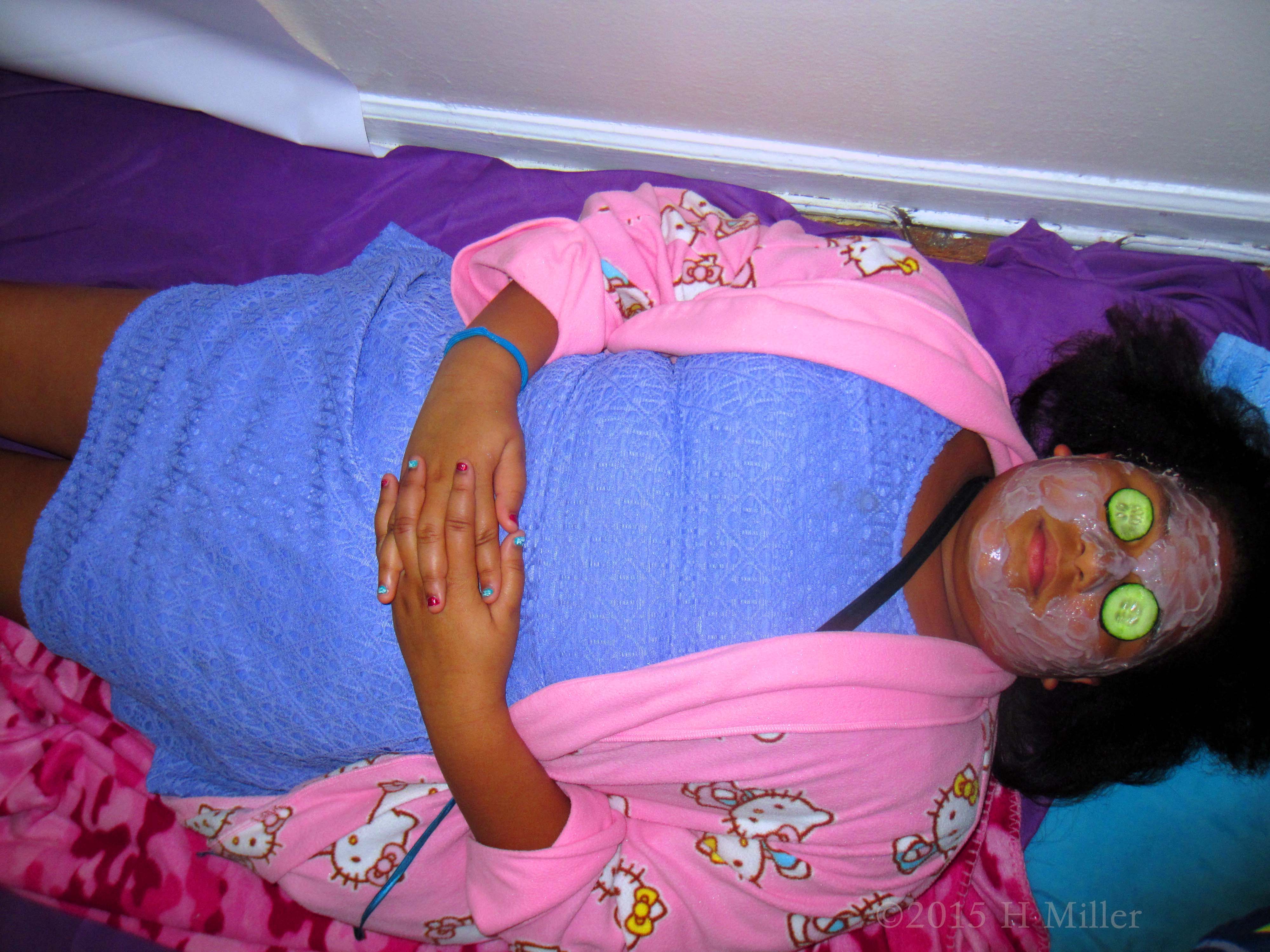 Her Hands Are Folded Showing How Calm And Relaxing The Kids Facial Activity Can Be 