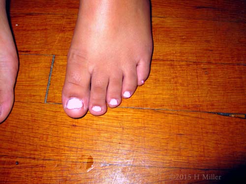 Her Kids Pedi Nails Are A Pretty Shade Of Pink