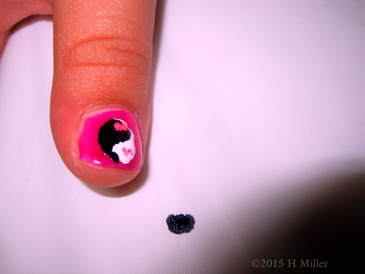 A Yin Yang Symbol On Her Thumb With Heart Dots! 