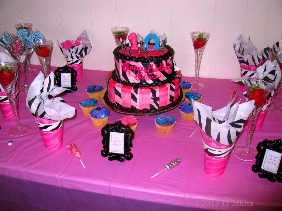 The Treats Table Is Full Of Appetizing Candy And Cake! 