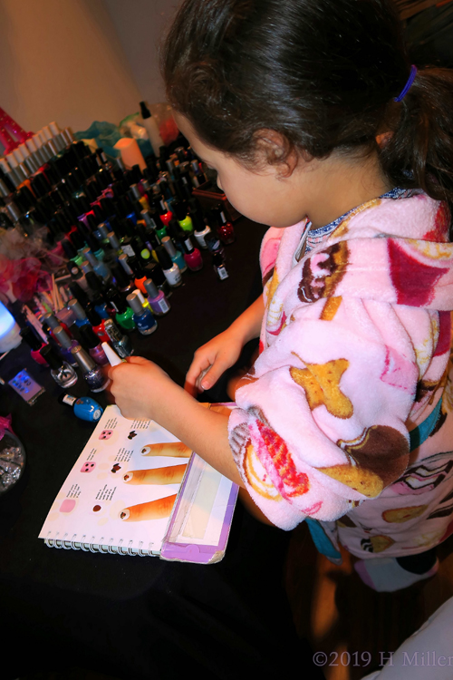 Curious Girl At The Kids Nail Salon Area